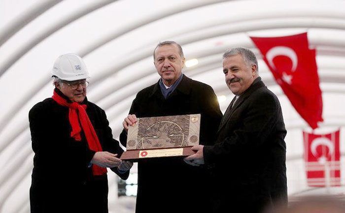 Turkish President Recep Tayyip Erdogan (center) poses for a photo while holding a memorial tablet with other influential figures in Turkey on Dec. 20 in Istanbul.