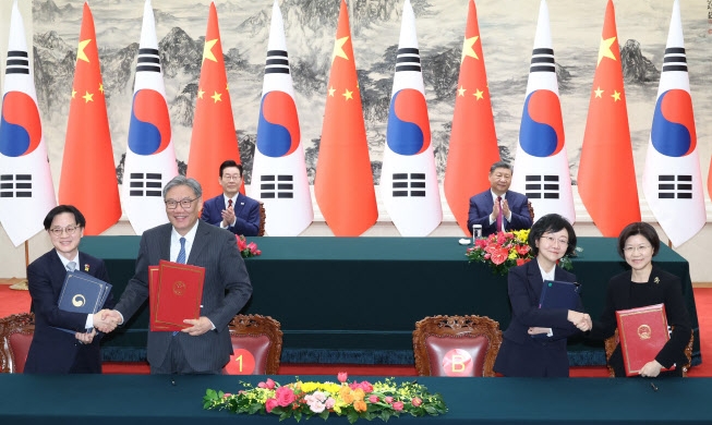 Seúl y Pekín acuerdan un diálogo comercial regular y firman 14 MOU