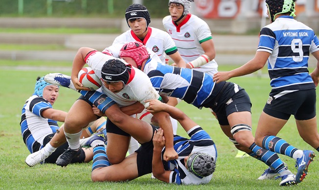 [Foto del día] Un feroz juego en el 102 Festival Nacional de Deportes