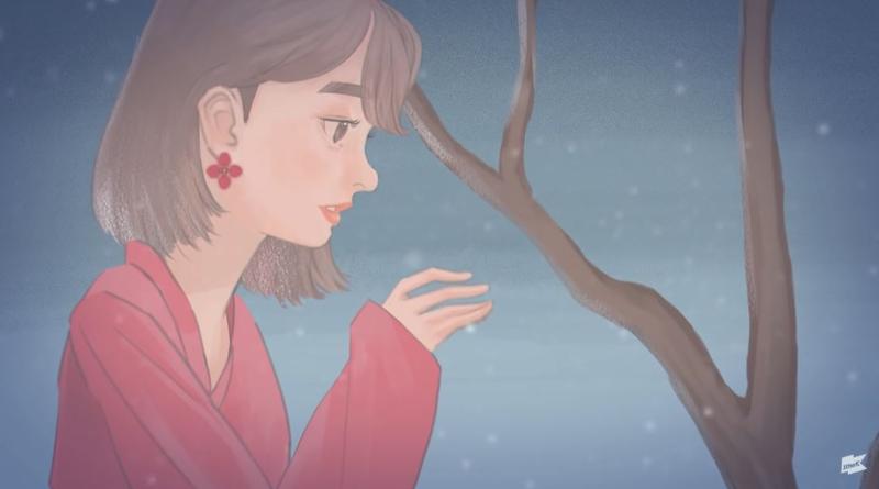 En el vídeo musical de “Winter flower (Flor de invierno)”, podemos ver a una chica que intenta proteger a un árbol durante una tormenta de nieve. | Captura de pantalla de canal 